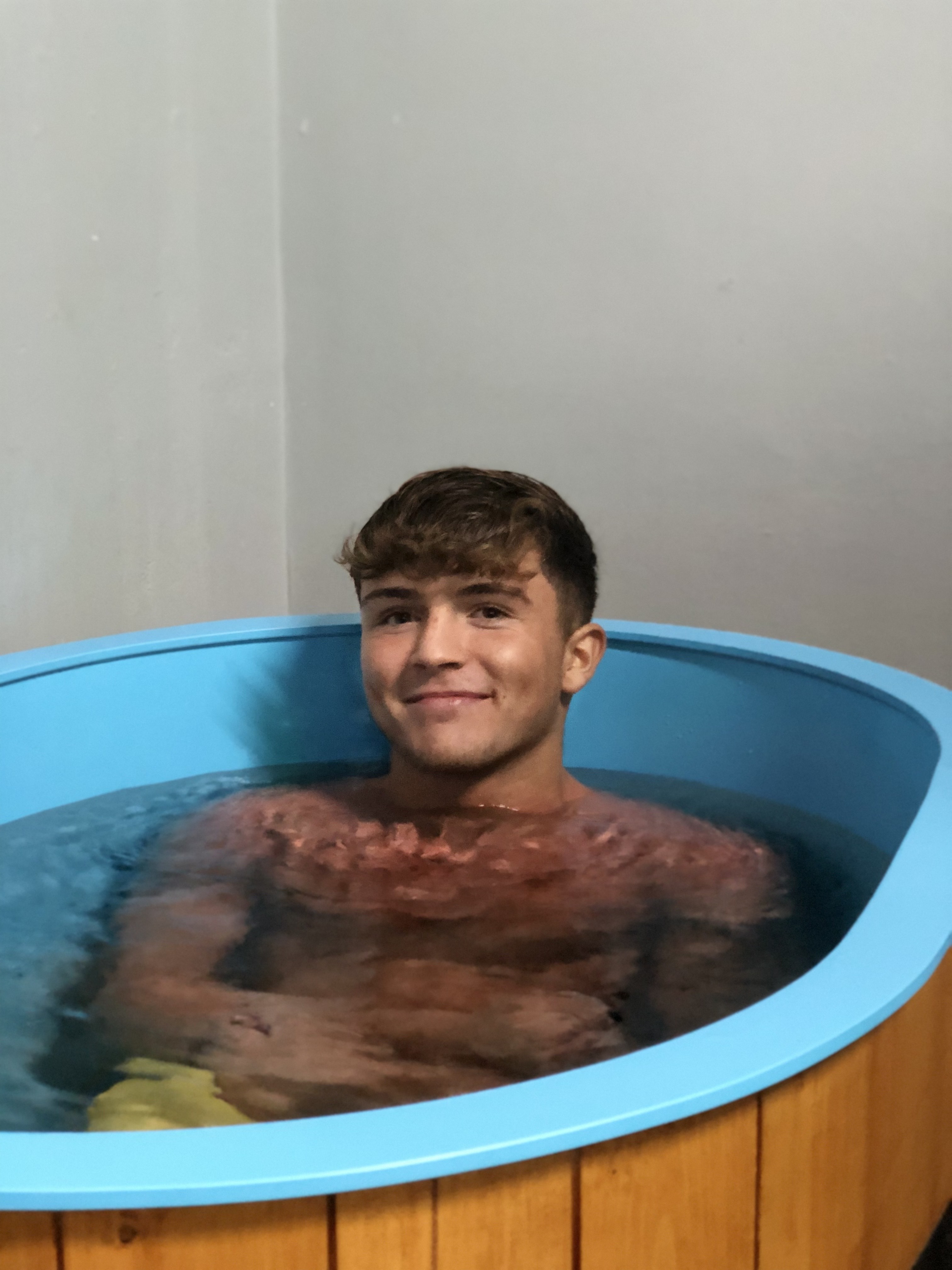 Smiling in the ice bath at BodyProject Gym